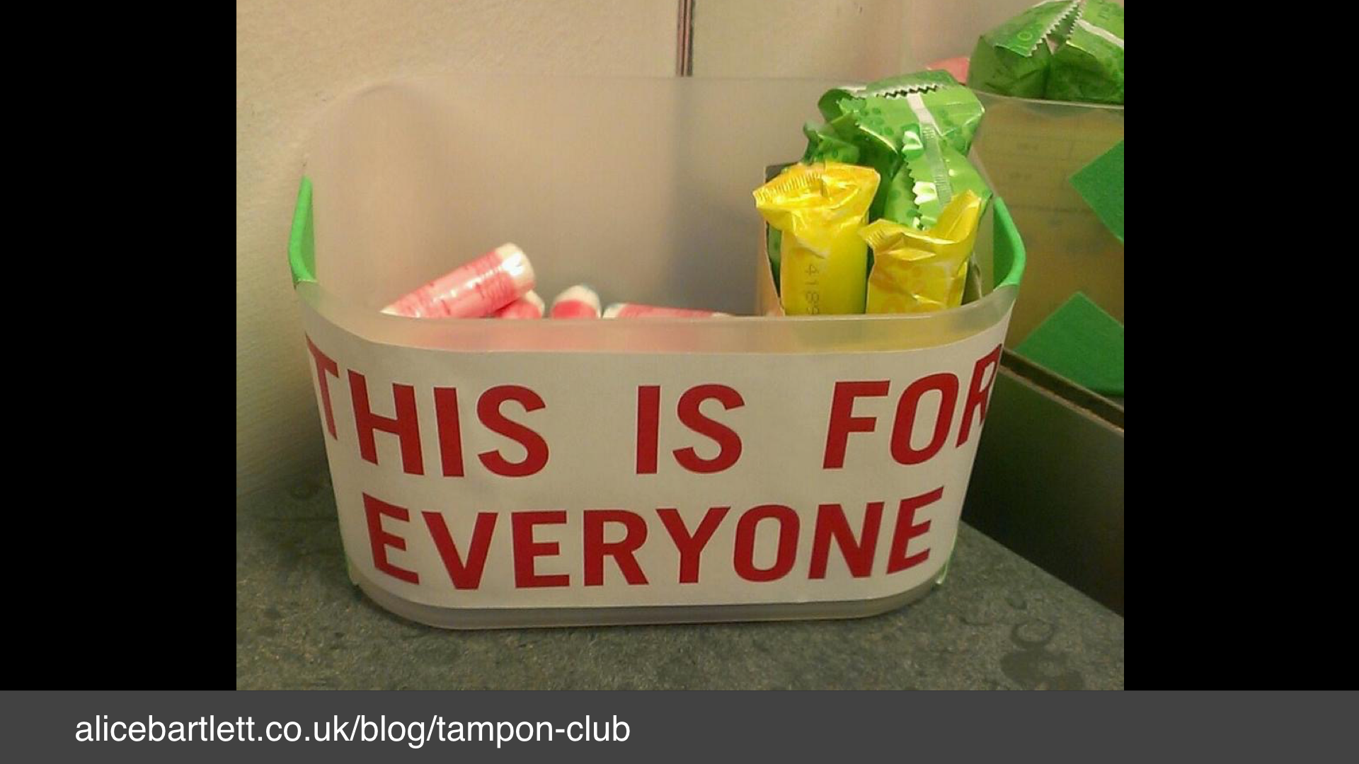 A photo of a basket of tampons with a label: "this is for everyone"
